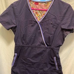 Koi brand women’s scrubs top.